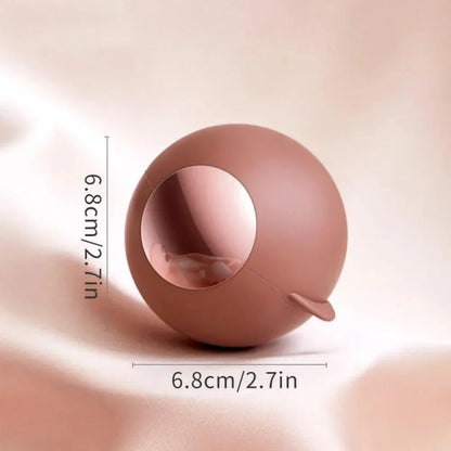 White, pink, green, and deep pink coloured ABS hair removal ball with a handle for pet hair and lint.
