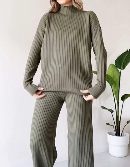 Women's turtleneck knitted suit set with loose split design and straight trousers in white, black, and green