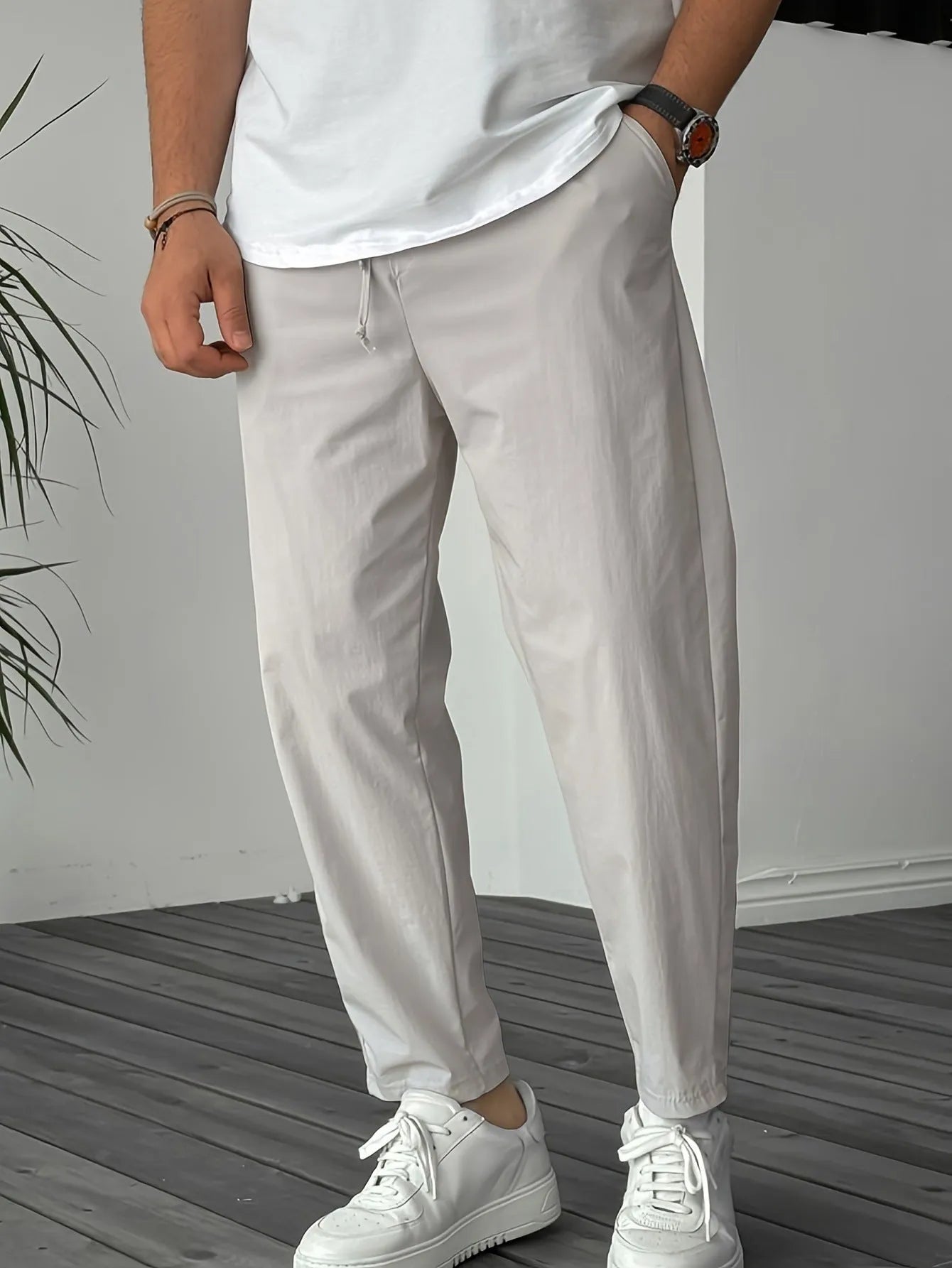 Men's khaki casual drawstring trousers with straight leg and ribbon detail on pockets