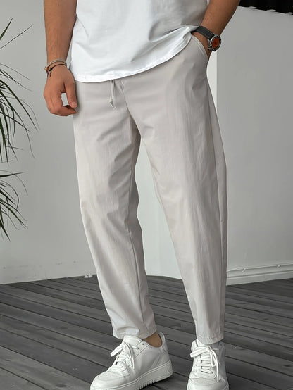 Men's khaki casual drawstring trousers with straight leg and ribbon detail on pockets