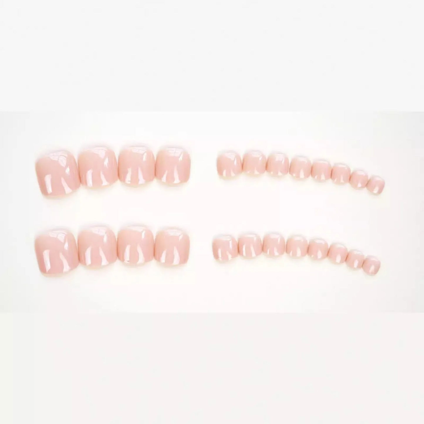 Fashion Personality toe nail stickers in skin colour with design, next to tube of adhesive glue on a flat surface.