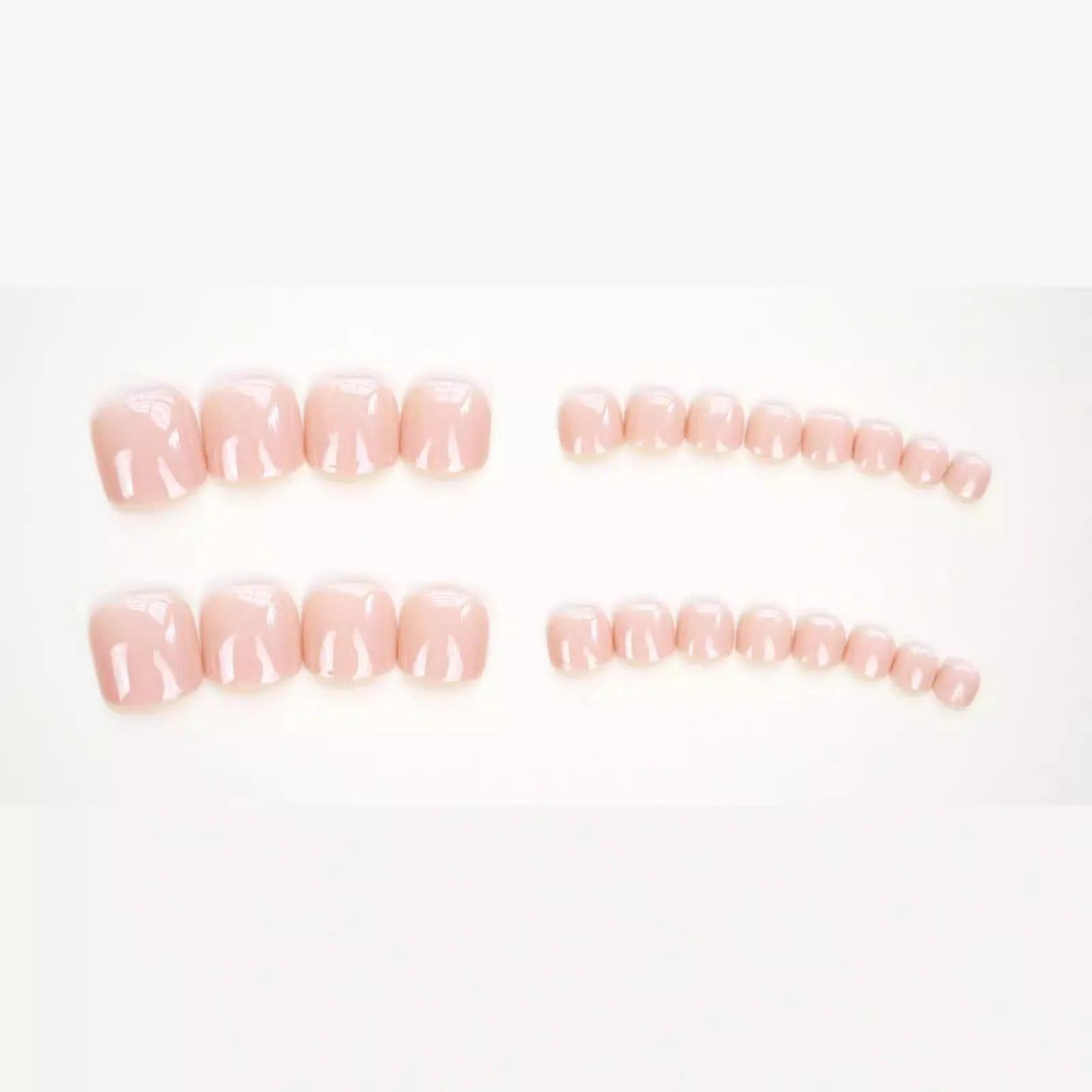 Fashion Personality toe nail stickers in skin colour with design, next to tube of adhesive glue on a flat surface.