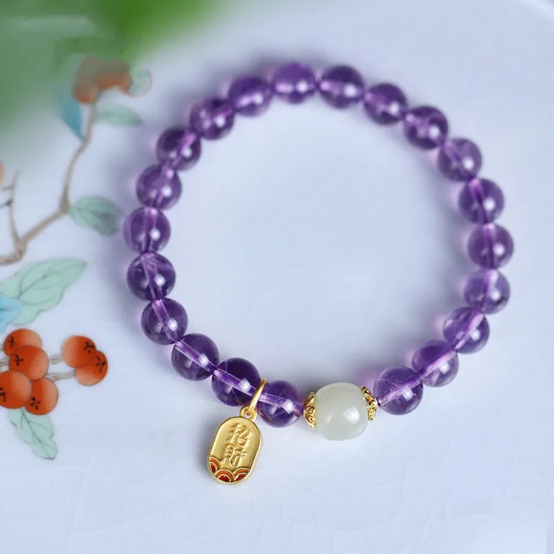 Purple amethyst crystal bead bracelet with geometric shape on an adjustable chain.