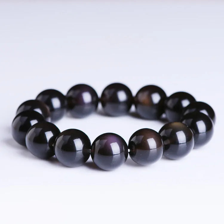 Natural Icy Obsidian crystal Pi Xiu bracelet with polished beads in ethnic geometric style.