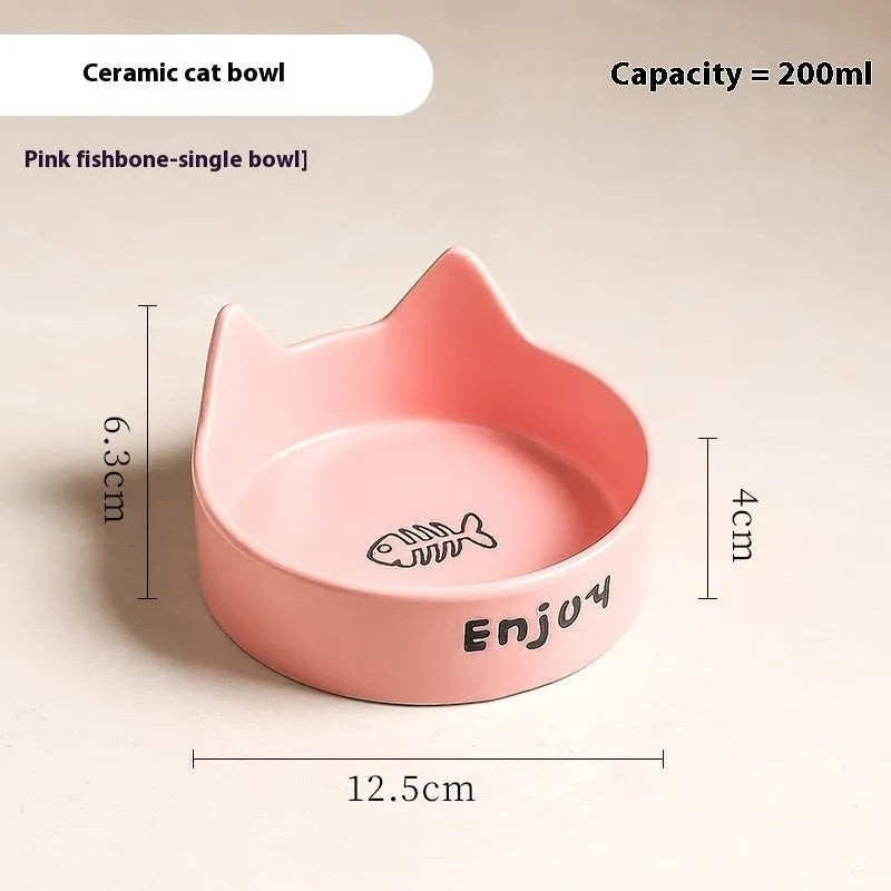 Porcelain cat bowl with anti-tumble wooden frame in pink with a cat paw design