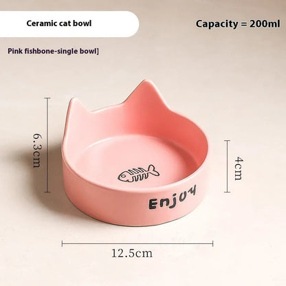 Porcelain cat bowl with anti-tumble wooden frame in pink with a cat paw design