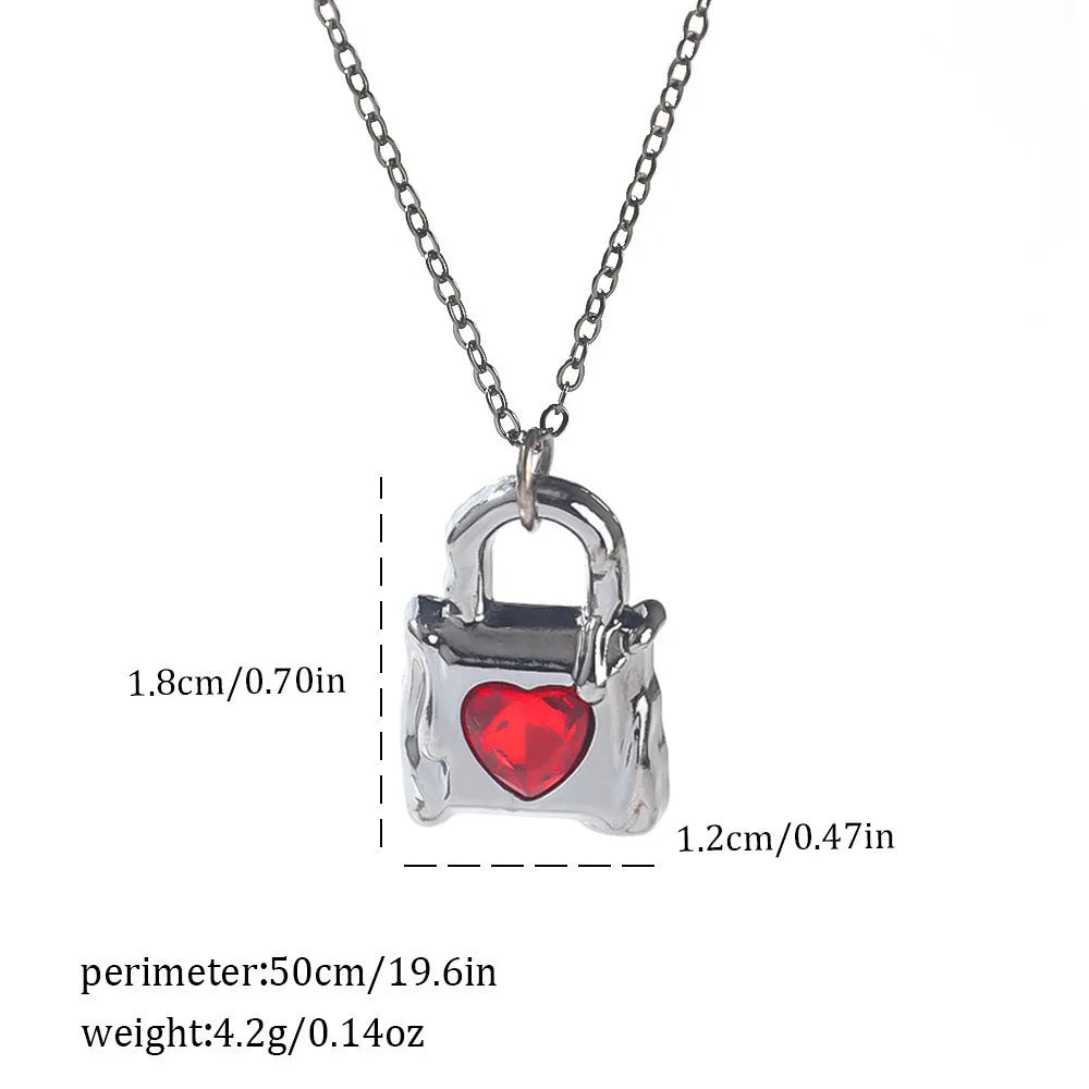 Gothic style zinc alloy necklace with bat pendant on a silver chain against dark background.