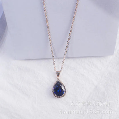 Rose gold geometric water drop pendant necklace on a model, showing adjustable chain and sparkling stone inlay.