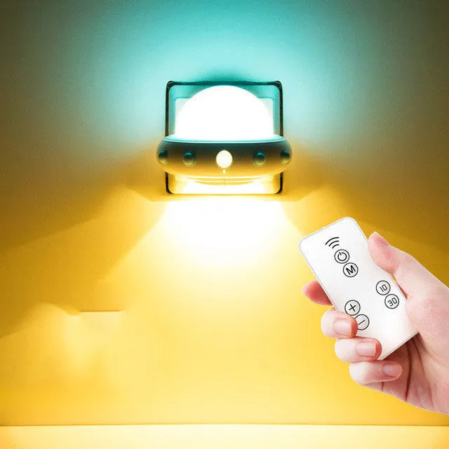 Remote control UFO bedside night light in blue, pink, or white colours with compact 105mm x 76mm dimensions