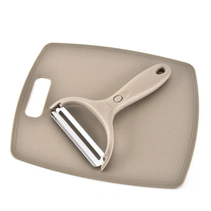 Three-piece kitchen cutter set with wheat straw chopping board, fruit knife, and peeler in green colour