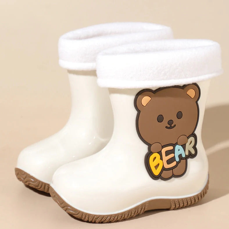 Children's PVC rain shoes with cartoon bear design showing waterproof construction and low heel