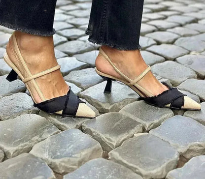 Apricot and black colour-block women's stiletto sandals with a buckle and pointed toe.
