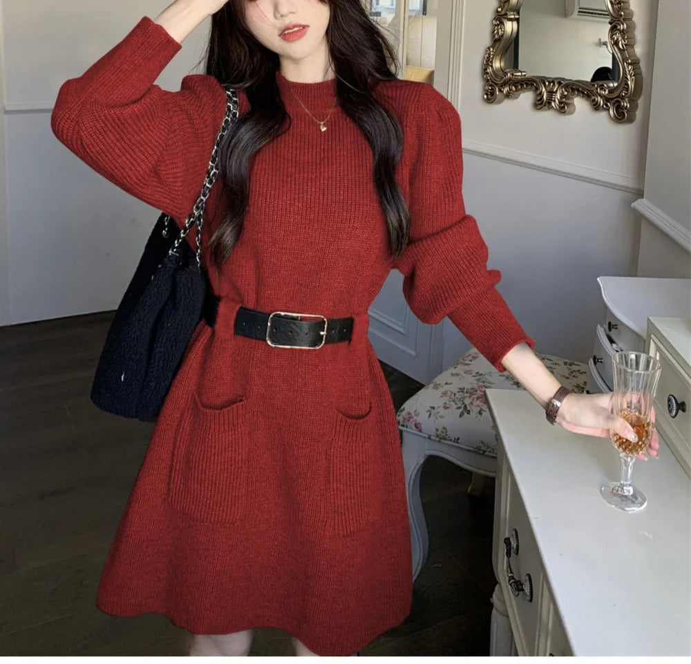 Women's long sleeve loose knitted dress in beige with black belt, showing high waist design and free size fit