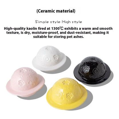 Handmade ceramic cinerary casket with cosmic starry sky design and cat-dog motifs in multiple colours