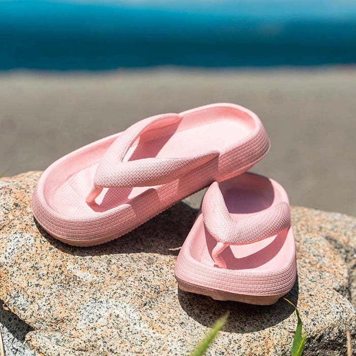 Comfortable beach flip flops with thick EVA sole in various colors for summer wear.
