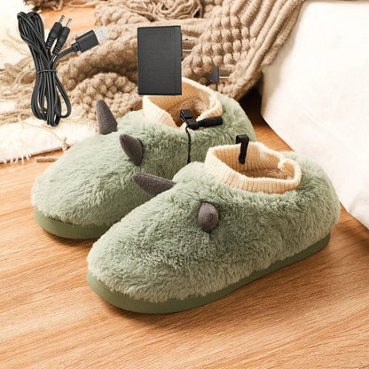 USB heated slippers in grey with a USB cable plugged into a power bank, showing the enclosed velvet design.