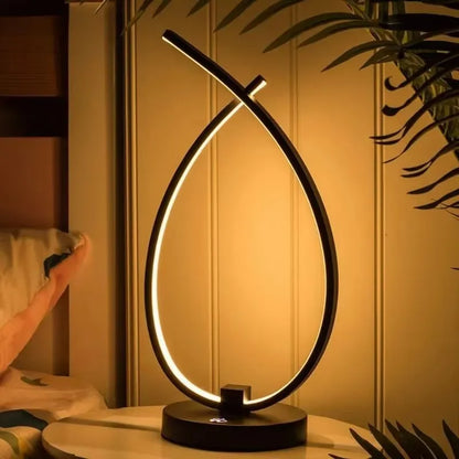 Black or white water drop shaped USB table lamp with touch control measuring 30cm tall