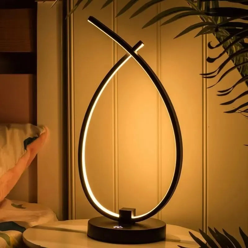 Table lamp with USB charging and touch control, bedside night light with 30cm height and 14cm width in black or white colour, modern water drop shape design for bedroom or study desk use with warm white lighting