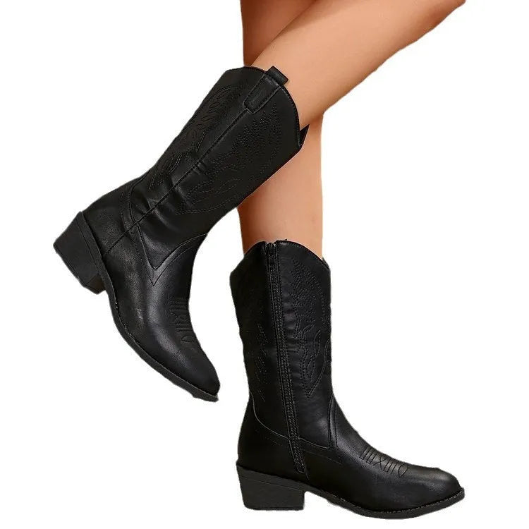 Women's black ankle boots with chunky heel, pointed toe, and hollow out detail on mid-calf winter boots