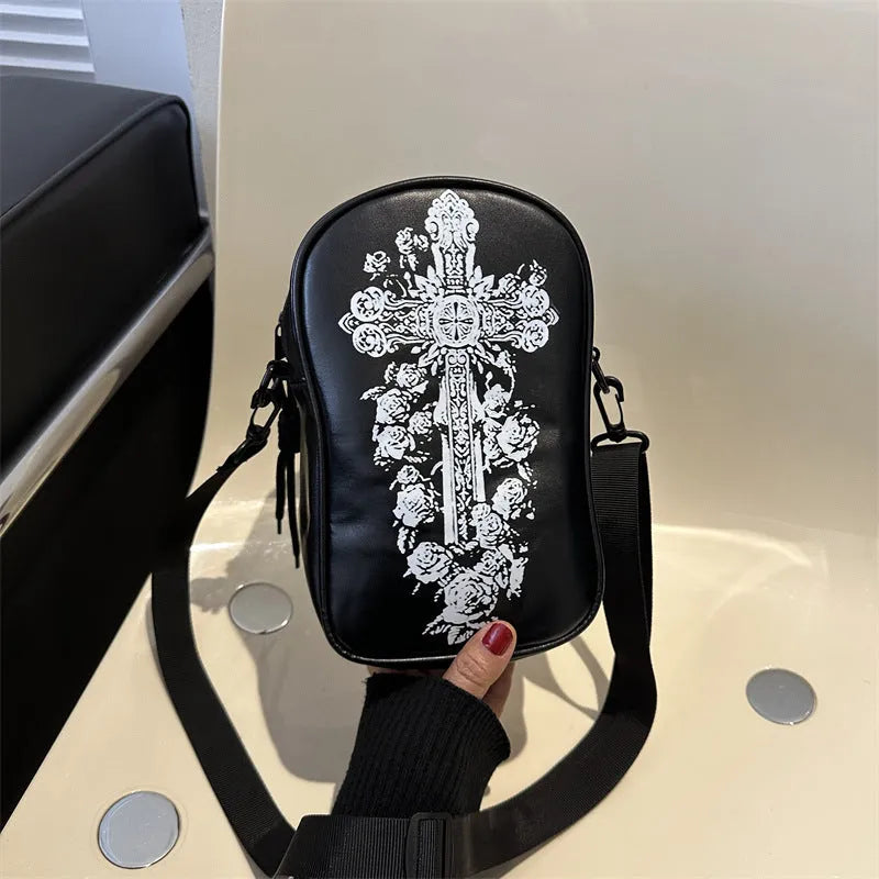 Halloween graffiti print crossbody bag in black with pumpkin, ghost, and bat designs, measuring 14x23x9.5cm
