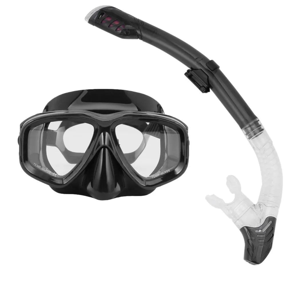 Black diving goggles with transparent anti-fog lens, adjustable silicone strap, and PC frame showing replaceable lens system