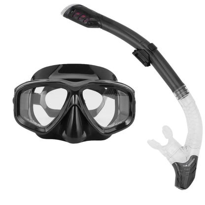 Black diving goggles with transparent anti-fog lens, adjustable silicone strap, and PC frame showing replaceable lens system
