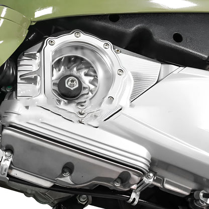 Vespa Primavera clutch intake cover in metallic finish shown on a scooter engine.