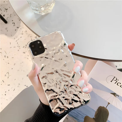 Rose gold electroplated TPU back cover case for iPhone on a table.