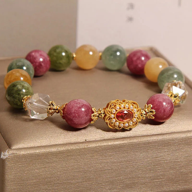 Jade colour tourmaline round bead bracelet for women with alloy inlay and rhinestones on a pearl crystal base.