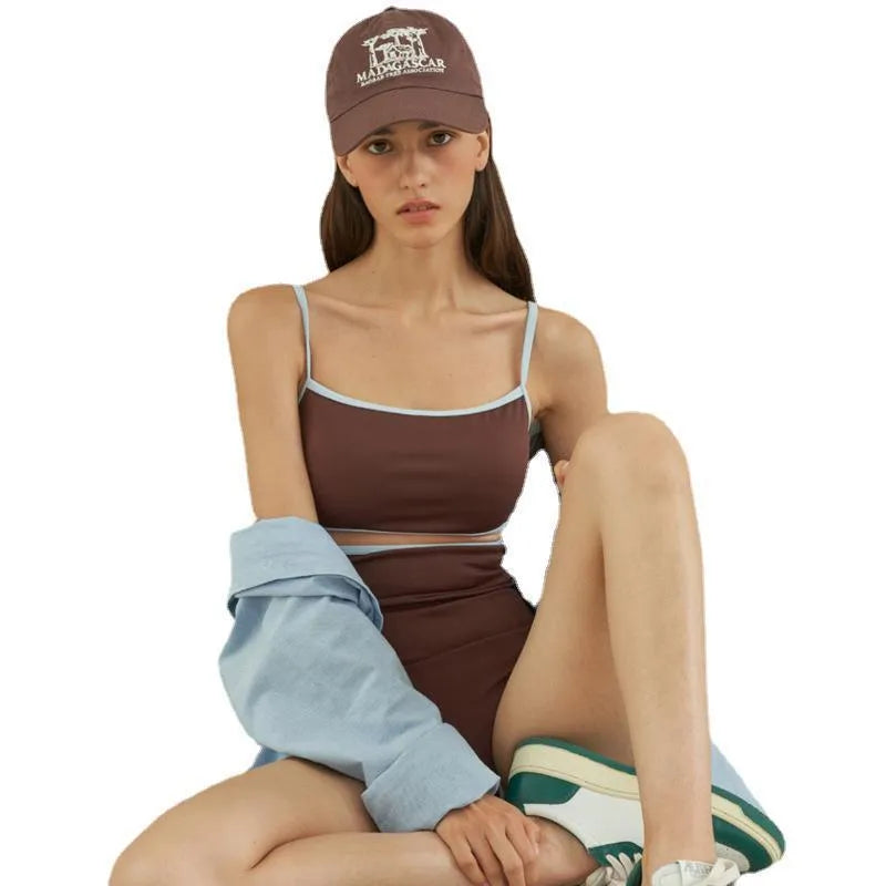Brown women's one-piece swimsuit with V-neck front and adjustable tie straps at neck and back.