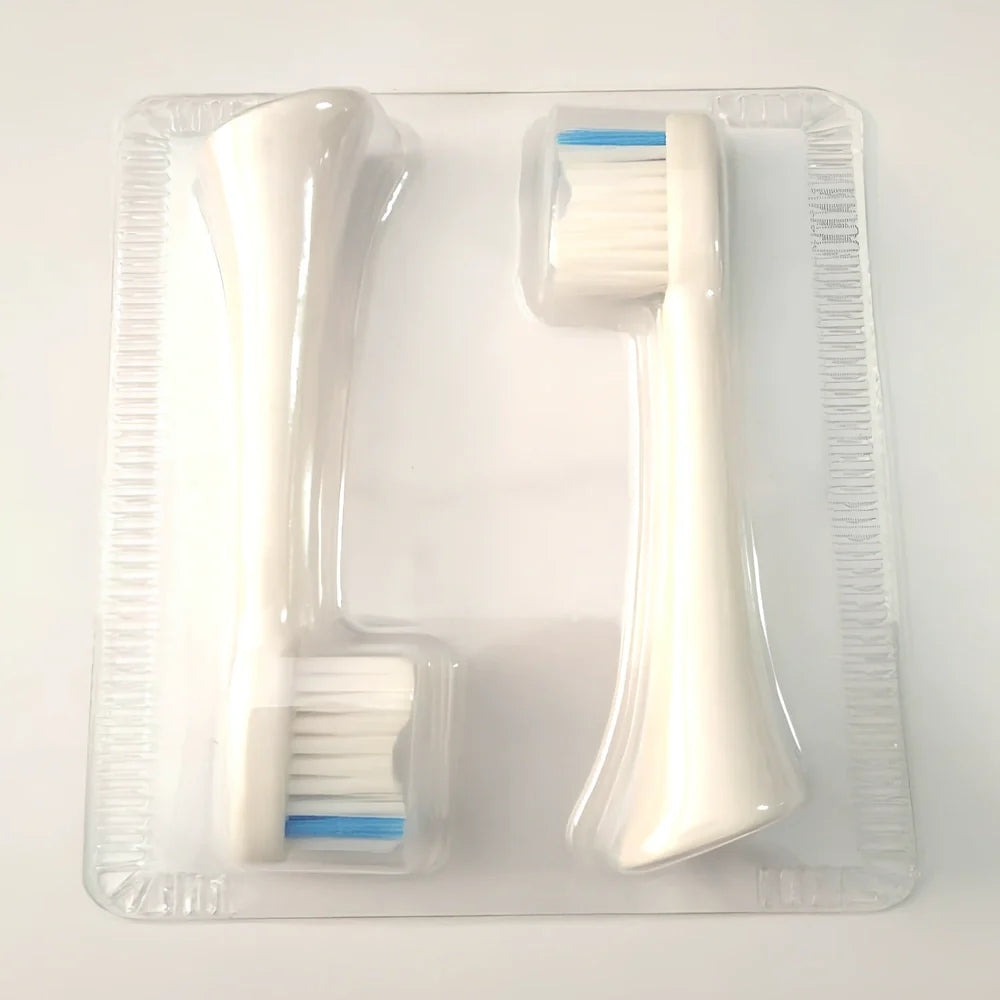 White waterproof electric toothbrush with inductive charging base showing 5 cleaning modes