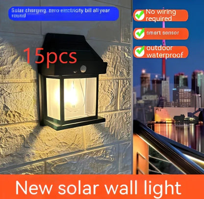 Black solar garden wall lamp with waterproof IP65 rating and automatic light sensor for outdoor installation