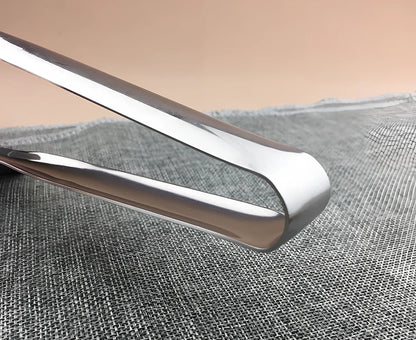 Stainless steel barbecue tongs with 32cm handles and serrated gripping surfaces