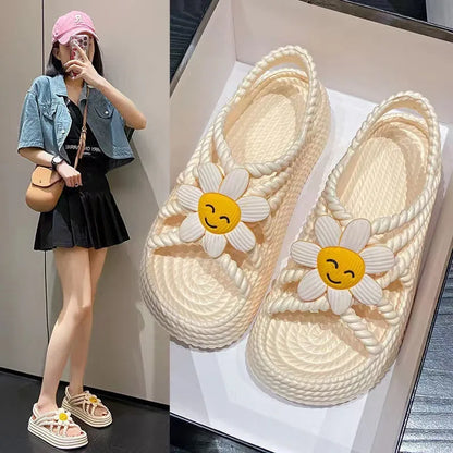 Women's beige PVC sandals with a sunflower pattern and round toe on a non-slip sole.