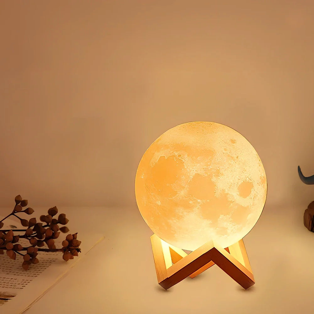 3D-printed moon night table lamp with remote control on wooden holder, showing lunar texture and adjustable brightness aperture