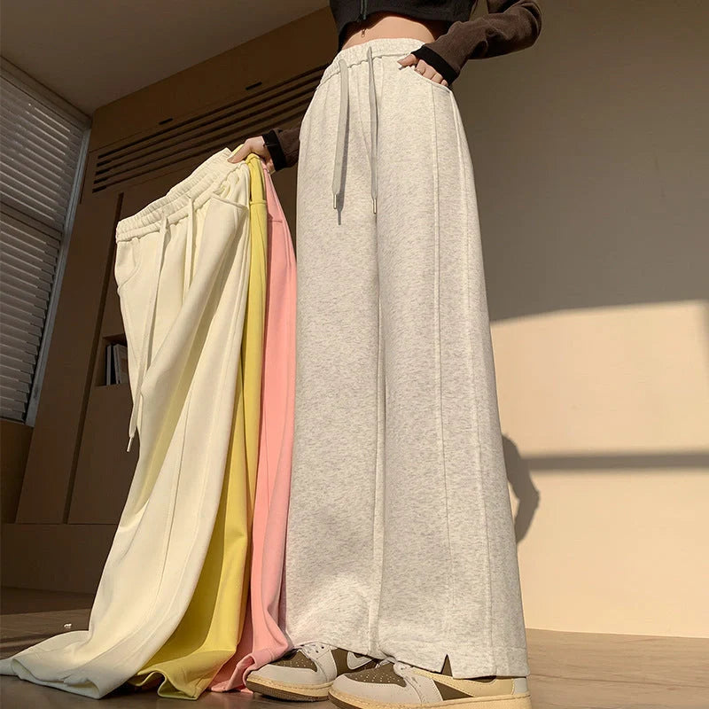 Comfortable cotton joggers in various colors and sizes, featuring a high-waist, straight-leg design for a relaxed, stylish look.