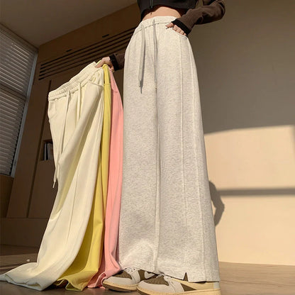 Comfortable cotton joggers in various colors and sizes, featuring a high-waist, straight-leg design for a relaxed, stylish look.