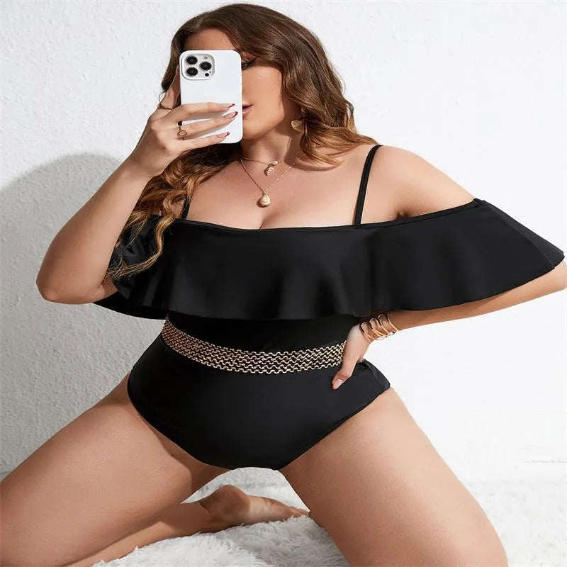 Black women's one-piece swimsuit on a mannequin, available in sizes 0XL to 4XL.