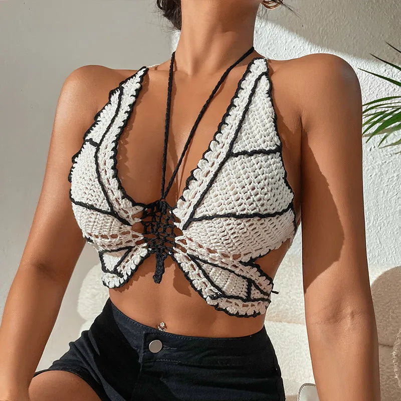 Black and white women's two-piece acrylic bikini swimsuit on a free-size hanger.