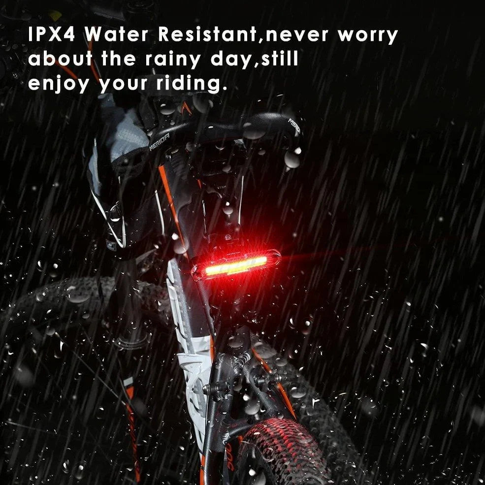 USB rechargeable red and blue mountain bike taillight with compact design and multiple lighting modes