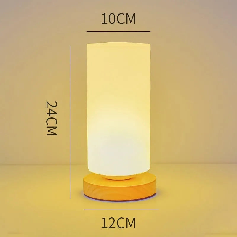 Nordic solid wood USB table lamp with touch dimming, 150x180mm size, and white light shapes on a bedside table