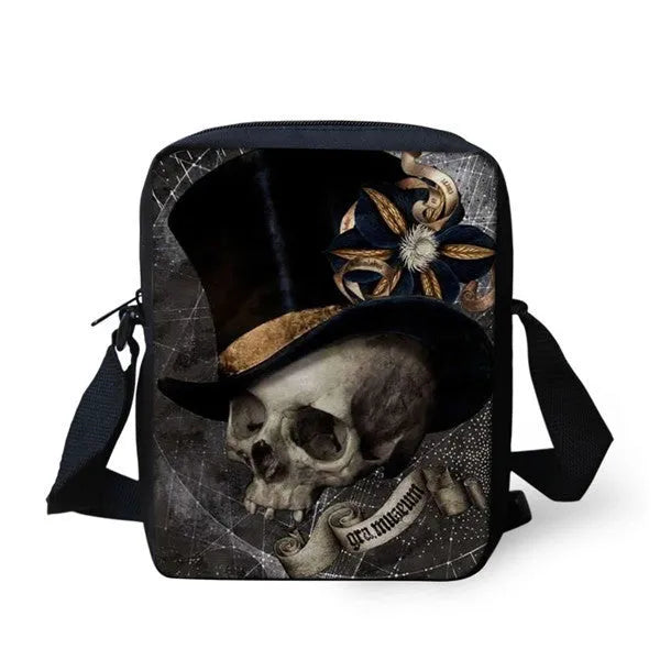 A medium-sized black messenger bag for kids with a white skull print, showing the double shoulder straps and top soft handle.