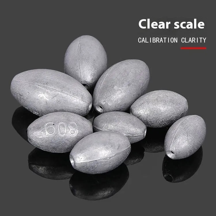 Rugby-shaped lead fishing sinker with scaled texture and plastic core protection for sea fishing