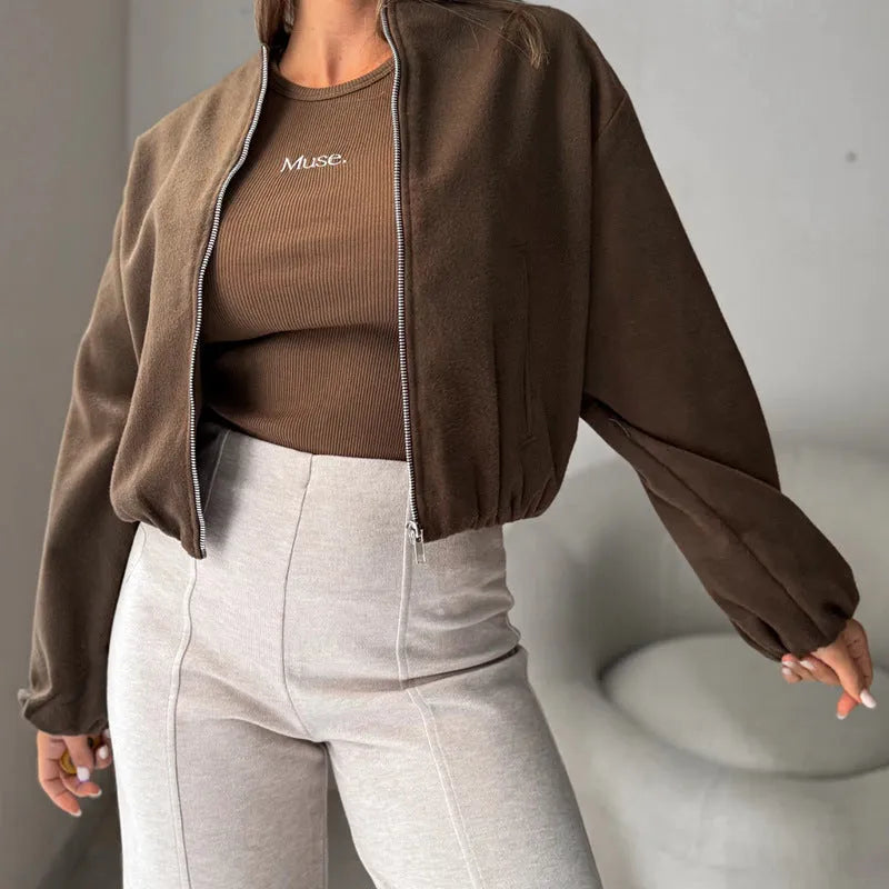 Brown women's off-shoulder short coat with lantern sleeves and pockets on a hanger.