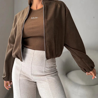 Brown women's off-shoulder short coat with lantern sleeves and pockets on a hanger.