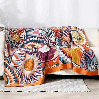 Pure cotton five-layer gauze bedspread blanket in Roulette Wheel Blue pattern on a bed.