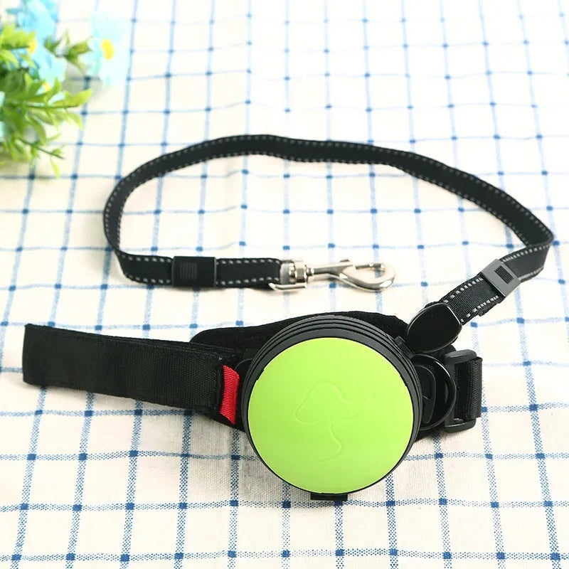 Automatic retractable dog leash extended to 3 metres with a lock button, shown in vibrant orange.