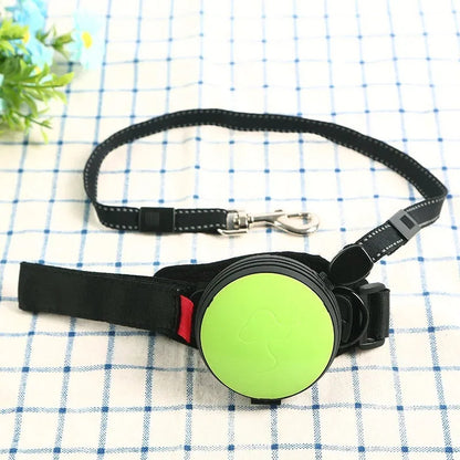 Automatic retractable dog leash extended to 3 metres with a lock button, shown in vibrant orange.