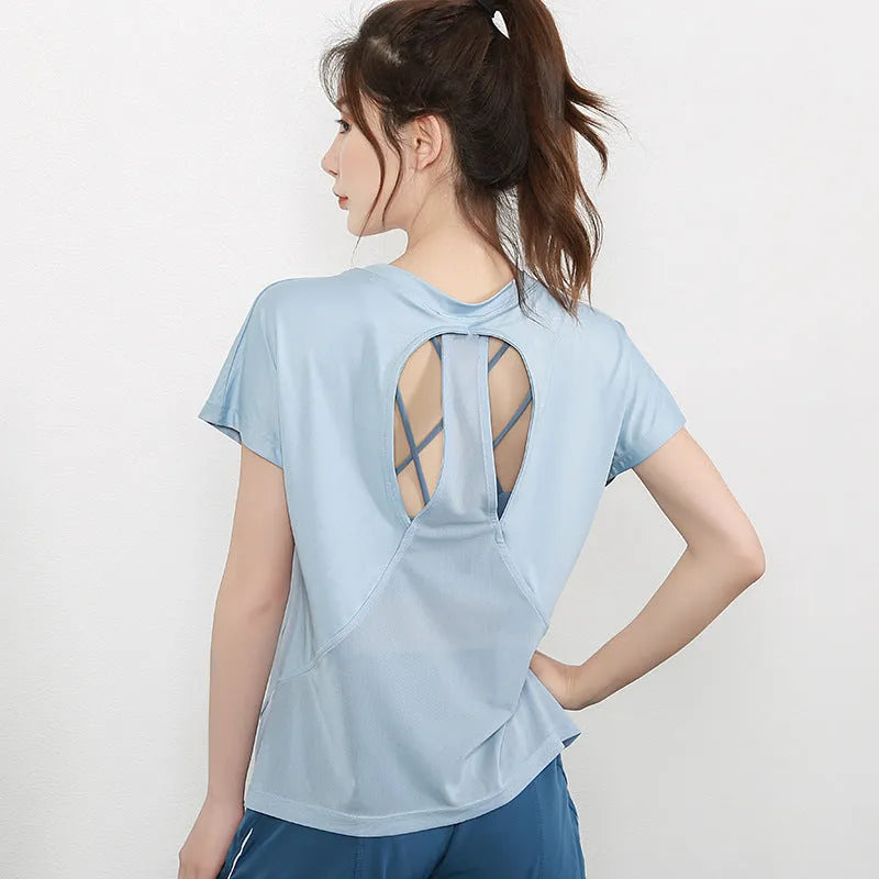 Women's pink short sleeve polyester sports T-shirt for fitness and running.