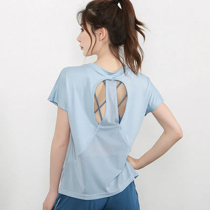 Women's pink short sleeve polyester sports T-shirt for fitness and running.